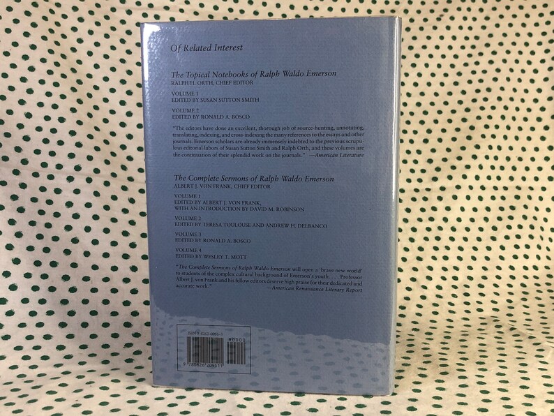 May include: A blue book cover with the title "The Complete Sermons of Ralph Waldo Emerson" and the author's name "Albert J. Von Frank, Chief Editor". The book cover also includes a list of the volumes and editors.