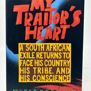 May include: A book cover with the title "MY TRAITOR'S HEART" in red, stylized lettering against a black background. The text "A SOUTH AFRICAN EXILE RETURNS TO FACE HIS COUNTRY HIS TRIBE, AND HIS CONSCIENCE" is in a yellow box. The author's name, RIAN MALAN, is in green.