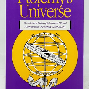 May include: A book titled "Ptolemy's Universe" with a purple cover and yellow lettering. The cover features a yellow circle with a globe illustration and the text "The Natural Philosophical and Ethical Foundations of Ptolemy's Astronomy".