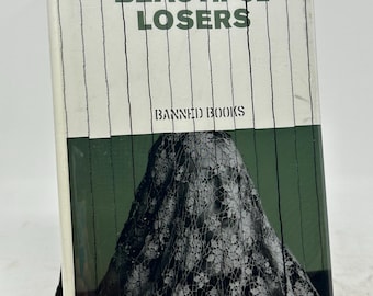 Serie de libros prohibidos "Beautiful Losers" de Leonard Cohen, publicada por The Independent en tapa dura en 2003.