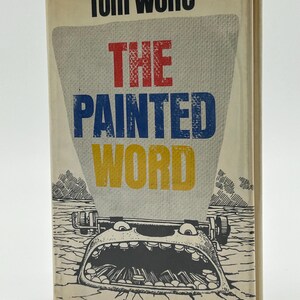 May include: A hardcover book titled "The Painted Word" by Tom Wolfe. The cover features the title in red, blue, and yellow, with a cartoon illustration of a typewriter with a large open mouth. The background is a light beige.