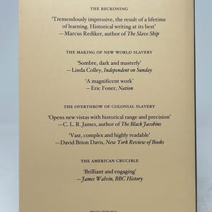 May include: The back cover of a book with text praising Robin Blackburn. Quotes from various sources are displayed, including Marcus Rediker and Linda Colley. The book's title and author are not visible. The cover is a light beige color.