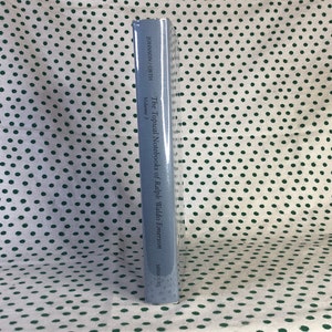 May include: The spine of a blue hardcover book titled "The Topical Notebooks of Ralph Waldo Emerson, Volume 3" by Johnson,  Couth.