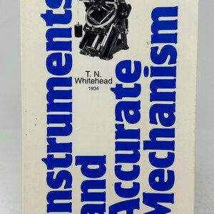 May include: A vintage book titled "Instruments and Accurate Mechanism" by T.N. Whitehead, published in 1934. The cover features a black and white illustration of a mechanical instrument and blue text on a cream background.