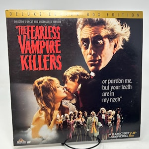 May include: A vintage LaserDisc box set for the film "The Fearless Vampire Killers". The cover displays a dramatic image with actors, red text, and the quote "or pardon me, but your teeth are in my neck."