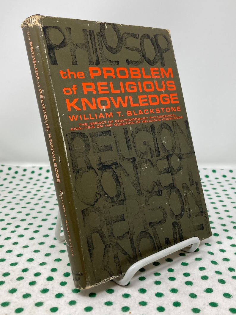 May include: A green book titled "The Problem of Religious Knowledge" by William T. Blackstone. The cover features the word "Religion" in large, overlapping letters.
