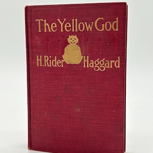 Pode incluir: Um livro de capa dura intitulado "The Yellow God" de H. Rider Haggard. O livro tem uma capa vermelha escura com letras douradas e uma ilustração dourada. O livro está em bom estado.
