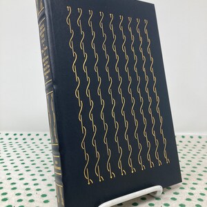 May include: A navy blue hardcover book with gold lettering on the spine. The title is "Where the  Fall", and the subtitle is "The Trials of  and the  of the  Elizabeth  Era". The cover features a repeating pattern of gold stylized "S" shapes.