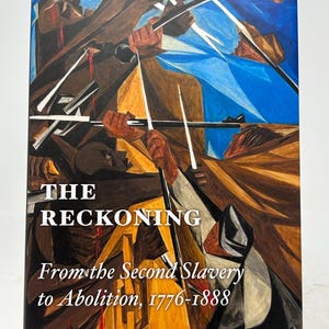May include: A hardcover book titled "The Reckoning" with the subtitle "From the Second Slavery to Abolition, 1776-1888" by Robin Blackburn. The cover features an abstract painting with figures in brown and blue tones.