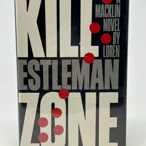 May include: A book cover for "KILL ZONE" by Loren D. Estleman. The title is in large white block letters, with the author's name and the words "A Macklin Novel" in smaller text. Red circular accents are scattered across the cover against a black background.