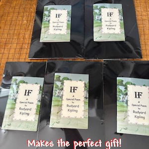 May include: Five copies of the poem "If" by Rudyard Kipling, each wrapped in black plastic and displayed on a wooden surface. The text on the front of each copy reads "IF A Special Poem by Rudyard Kipling". The text "Makes the perfect gift!" is written in red at the bottom of the image.
