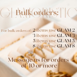 May include: A close-up image of a jewellery display with gold rings in a white box. The text reads "Bulk orders: 2 items use GLAM 2, 3 items use GLAM 3, 5 items use GLAM 5, 8 items use GLAM 8. Message us for orders of 10 or more."
