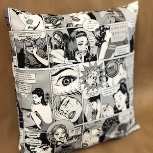 May include: Black and white throw pillow with a comic book pattern featuring women in various poses and expressions. The text on the pillow reads "Modern Sewing Woes".
