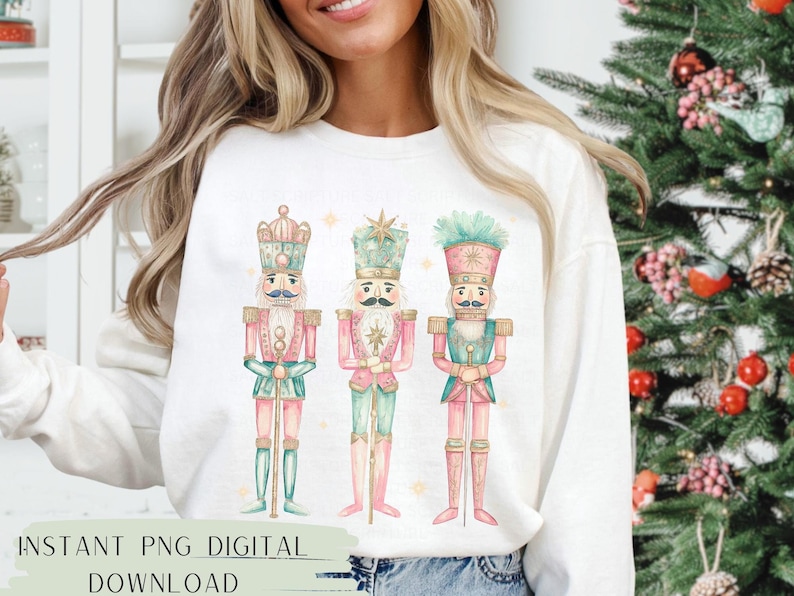 May include: Three watercolor nutcracker soldiers in pink, green, and gold. The nutcrackers are standing in a row and have a whimsical, festive look.