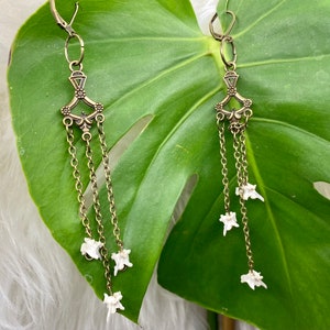 Snake vertebrae earrings.