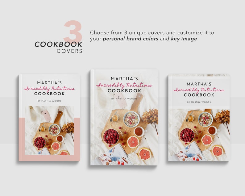 May include: Three different cookbook cover designs featuring a white background with the title "Martha's Incredibly Nutritious Cookbook" in pink script. Each cover features a photograph of a wooden tray with a bowl of granola, raspberries, a grapefruit, and a cup of tea.