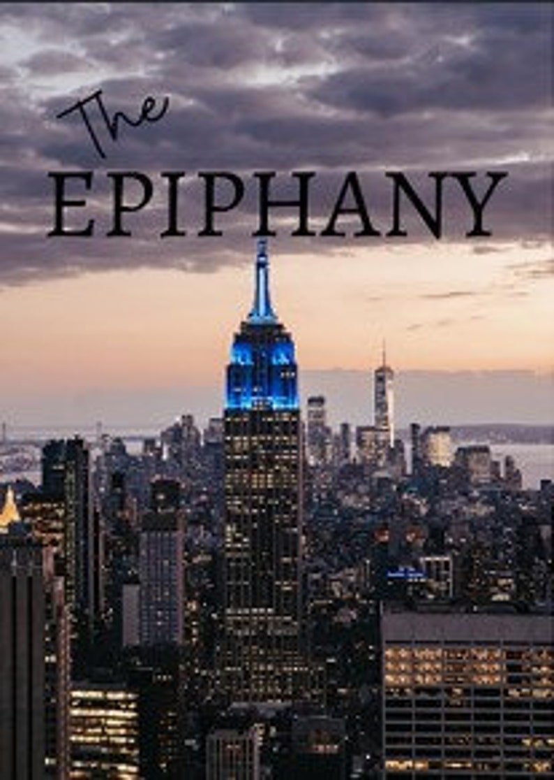 May include: A panoramic view of the New York City skyline at sunset, with the Empire State Building illuminated in blue in the foreground.