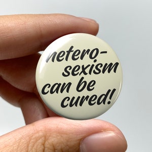 LGBTQ &quot;heterosexism can be cured!&quot; Pin-back Button | Lesbian Subtle Gay Pins Bisexual Trans Queer Nonbinary Sapphic WLW Gay Pride Meme Gen Z