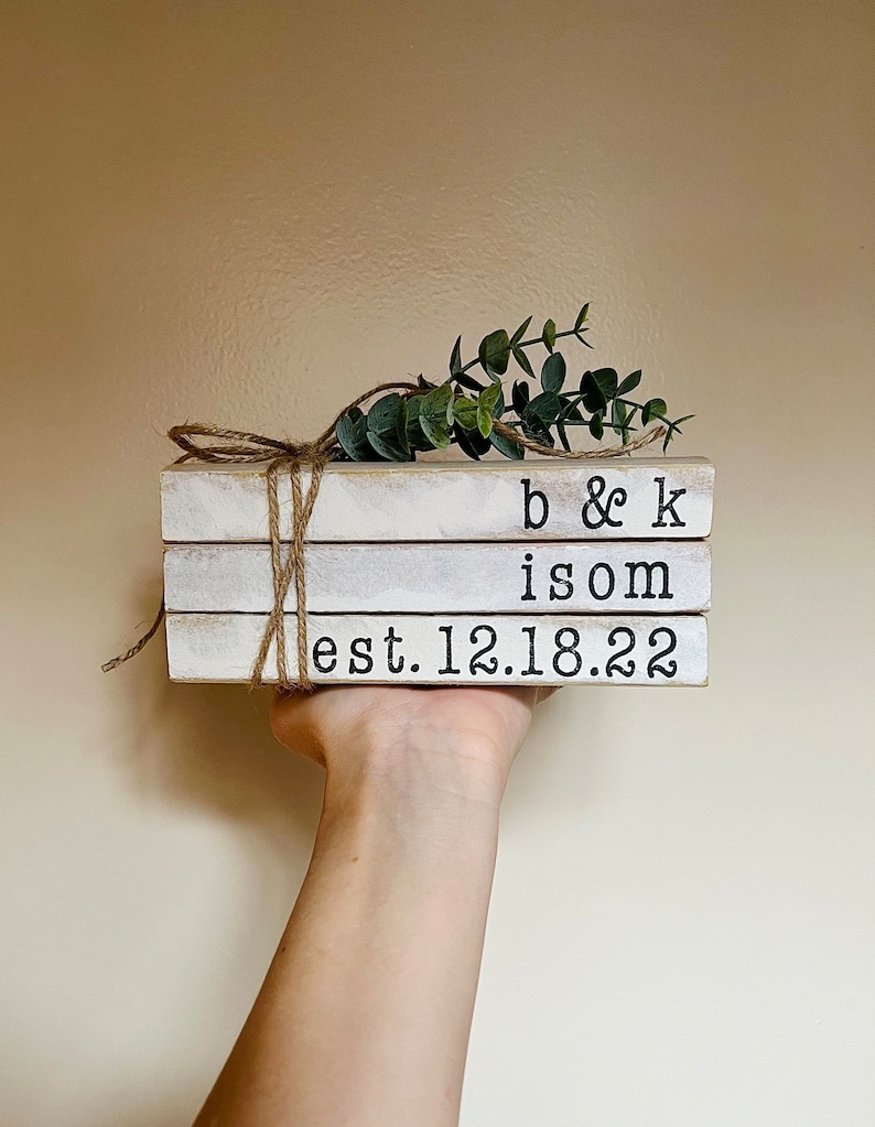 Established date books stacked - with greenery