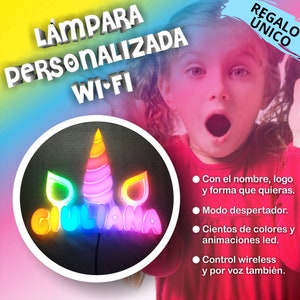 May include: A personalized LED lamp with the name "GIULIANA" in colorful neon lights, shaped like a unicorn. The lamp has Wi-Fi capabilities and is advertised as a unique gift. The image also includes text in Spanish.