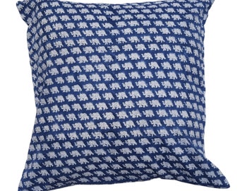 May include: Blue cotton pillow cover with a white elephant print. The elephants are arranged in a repeating pattern.