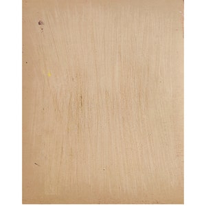 May include: A rectangular piece of light brown fiberboard with a textured surface. The material displays vertical brush-like streaks across its face, with a few small, scattered dark and yellow spots visible on the left side of the board.