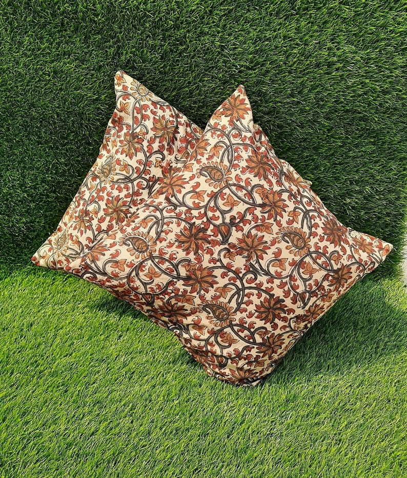 May include: Two cream-colored pillowcases with a brown and black floral pattern. The pillowcases are made of cotton and have a soft, comfortable feel.