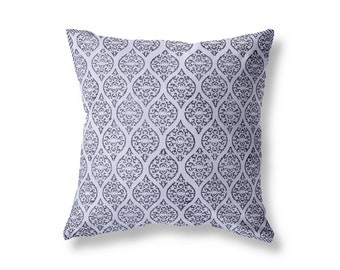 May include: A light purple throw pillow with a black and white geometric pattern.