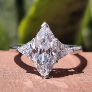 Marquise Moissanite Engagement Ring: Trillion Side Stone, Three Stone Design