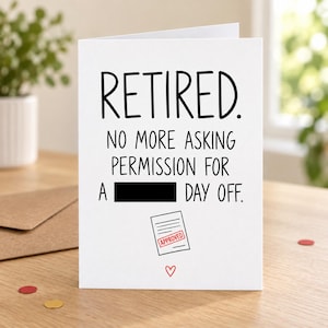 Lifestyle mock-up of a standing retirement card about permission for a day off, with one word covered by a black bar and an APPROVED-form doodle. On a wooden table beside a Kraft envelope and red/gold confetti.