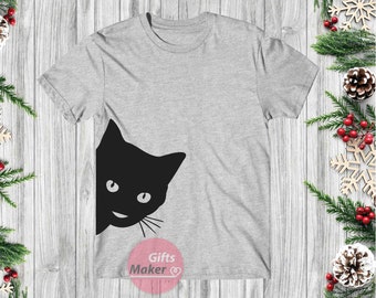 May include: A gray t-shirt with a black cat peeking out from the side. The cat has a mischievous grin and large, round eyes. The t-shirt has the text "Gifts Maker" printed on the bottom.