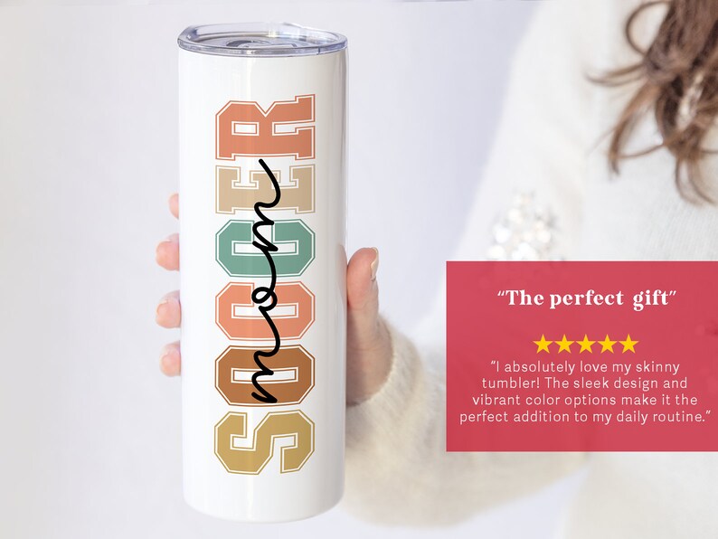 May include: White tumbler with the word "Soccer" in colorful retro-style letters and the word "Mom" written in cursive. The tumbler is being held by a hand. The text "The perfect gift" is written in red with five yellow stars below it.