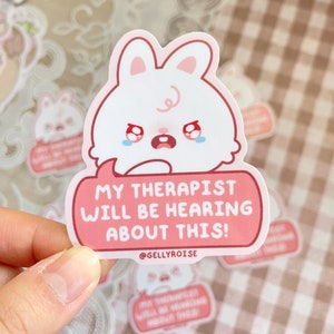 cute, white, crying bunny saying "My therapist will be hearing about this!" pink sticker