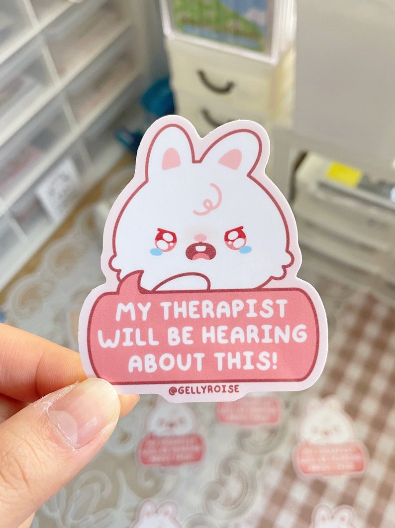cute, white, crying bunny saying "My therapist will be hearing about this!" pink sticker