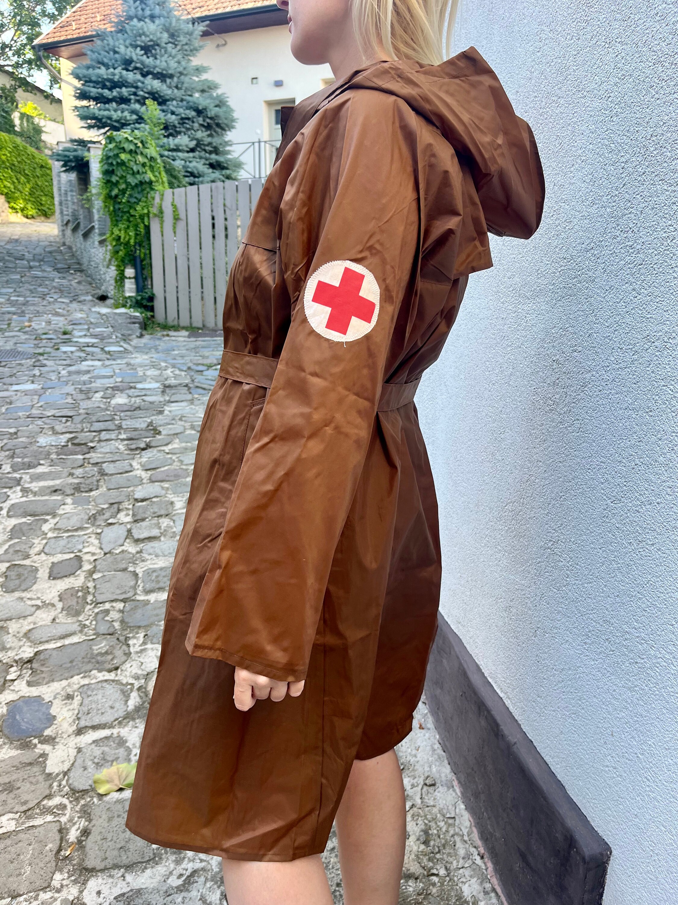 Vintage 1970s women’s chocolate brown nylon rain coat, Czechoslovakia by Piestanka, belt, hood, small bag, dead stock;  with Red Cross logo