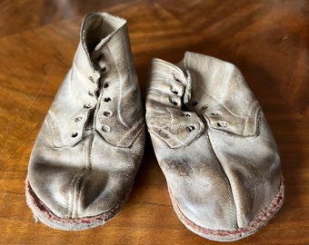 A pair of antique, very old child shoes, leather, an interesting decorative display piece, minimally 100 year old