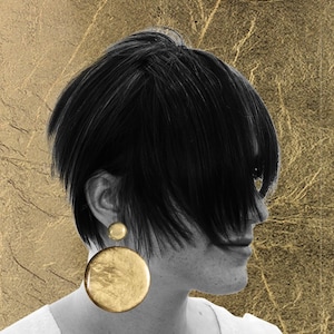 May include: A pair of gold-colored, round earrings. The earrings feature a small, circular stud and a larger, flat disc. The background is a textured, gold-colored surface. The image is in black and white with the earrings in color.