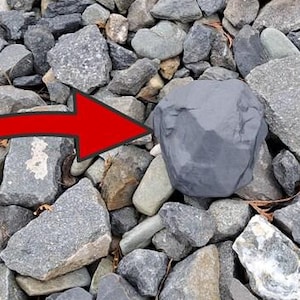stone complete geocache (logbook and rubber seal included)