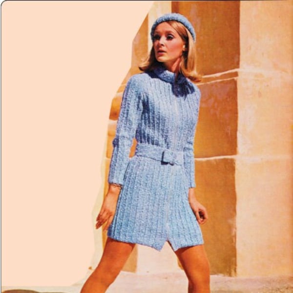 Women's knitted coat dress pattern with matching hat, front zipper, roll neck, long sleeves and sweet bow belt at the waist. Double knit.