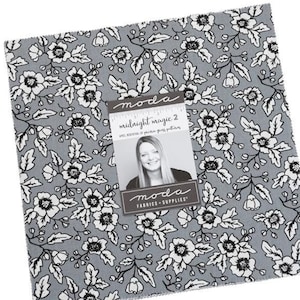 May include: A Moda Midnight Magic 2 fabric bundle featuring a gray background with a white floral pattern. The bundle includes a variety of pre-cut fabric squares.