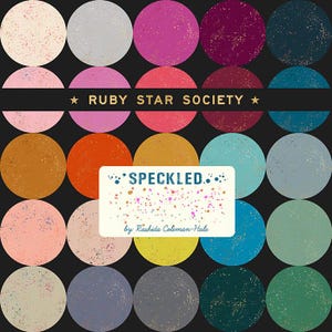 May include: A fabric design featuring a grid of speckled circles in various colors, including pink, orange, teal, and gray, against a black background. The text "RUBY STAR SOCIETY" and "SPECKLED" are also present.