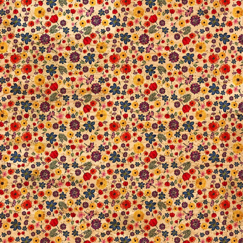 May include: A floral pattern featuring a variety of colorful flowers, including red poppies, yellow daisies, blue forget-me-nots, and purple blooms, set against a light beige background. The design has a vintage, slightly distressed look.
