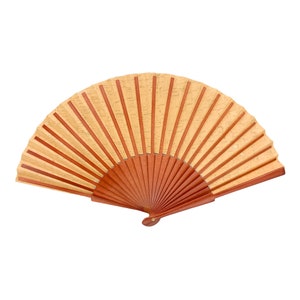 May include: A brown and beige hand fan with a wooden handle. The fan is closed and has a decorative pattern.