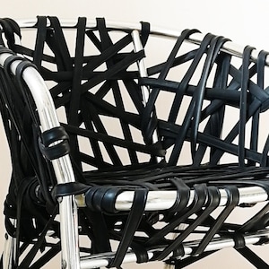 Spora chair with armrests in steampunk industrial style