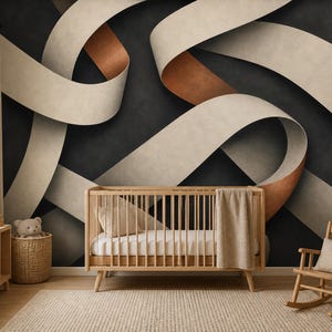 May include: A wooden crib with a white mattress and a beige blanket, positioned against a wall mural featuring large, flowing, cream-colored ribbons with copper-toned undersides set against a dark, textured charcoal gray background.