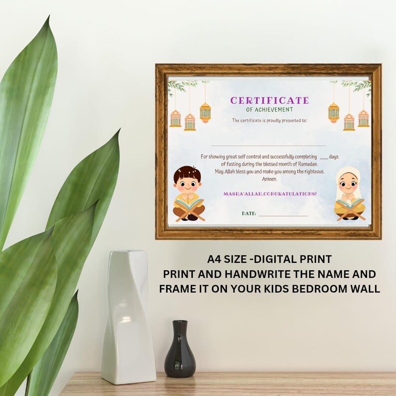 May include: A printable certificate of achievement for Ramadan. The certificate features a light blue background with a pink border. The text "CERTIFICATE OF ACHIEVEMENT" is in a purple font. The certificate is decorated with illustrations of two children, a boy and a girl, both wearing traditional Islamic clothing and holding books. The certificate is framed in a brown frame.