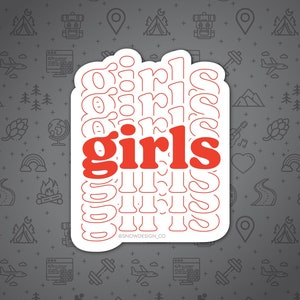 May include: White sticker with a red outline of the word "girls" repeated multiple times. The word "girls" is in a larger font and red in the center of the sticker. The text "@SNOWDESIGN.CO" is at the bottom of the sticker.