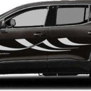 May include: A dark brown SUV with white wave-like decals on the side. The vehicle has black tires and silver rims. The windows are tinted, and the taillights are red.