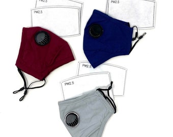 May include: Three reusable face masks with PM2.5 filters. The masks are in burgundy, navy blue, and grey. Each mask has a black valve.