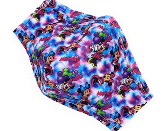 May include: A blue and pink face mask with a repeating pattern of Minnie Mouse holding balloons. The mask has a white background with a tie-dye effect.